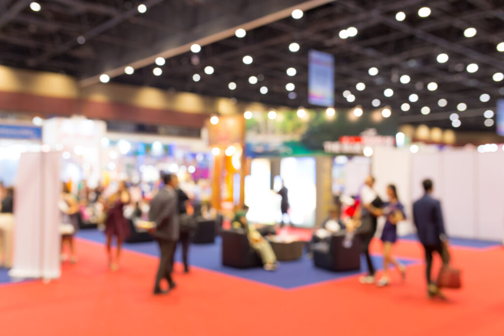 abstract blurred event exhibition with people background, business convention show concept